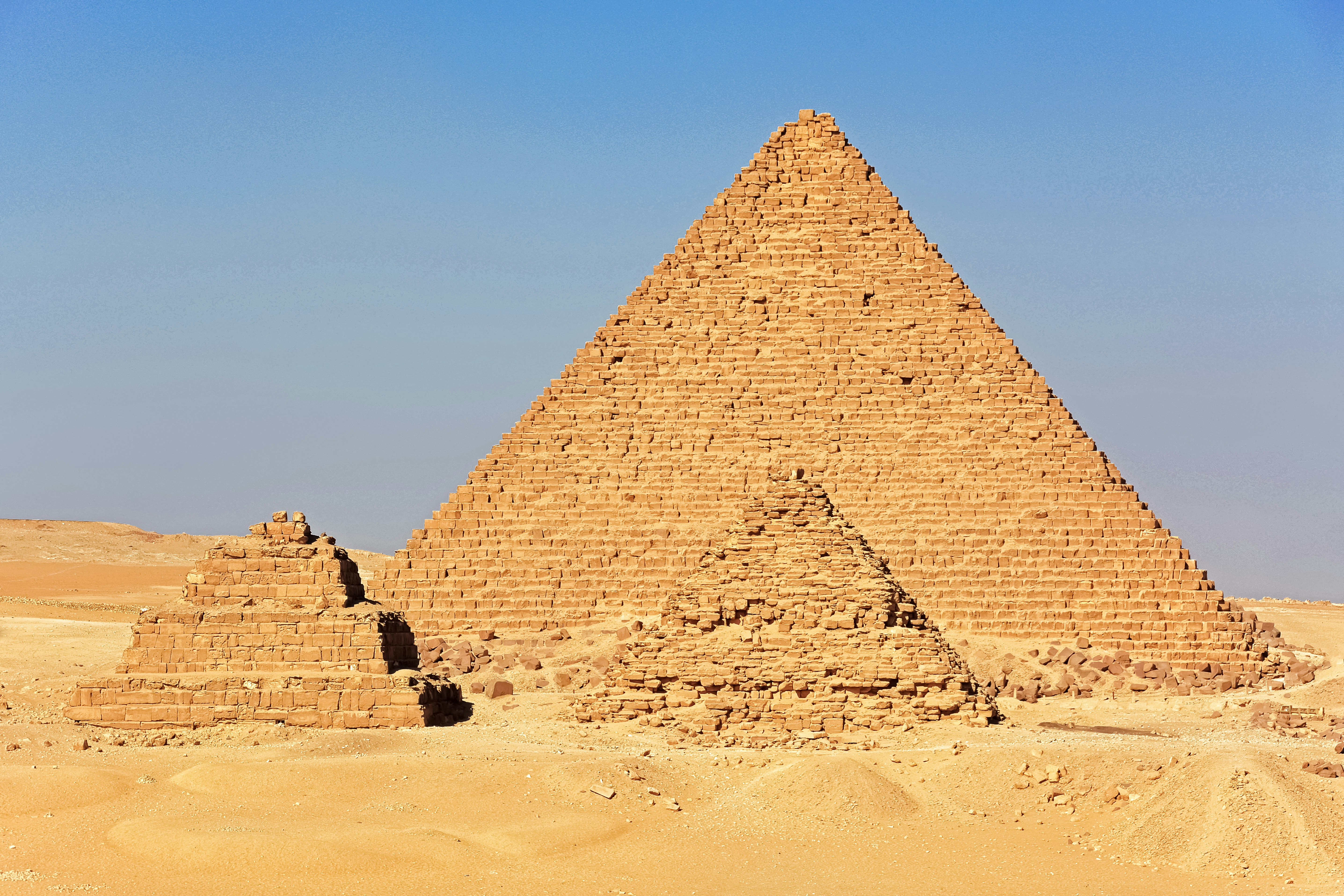 brown pyramid under blue sky during daytime